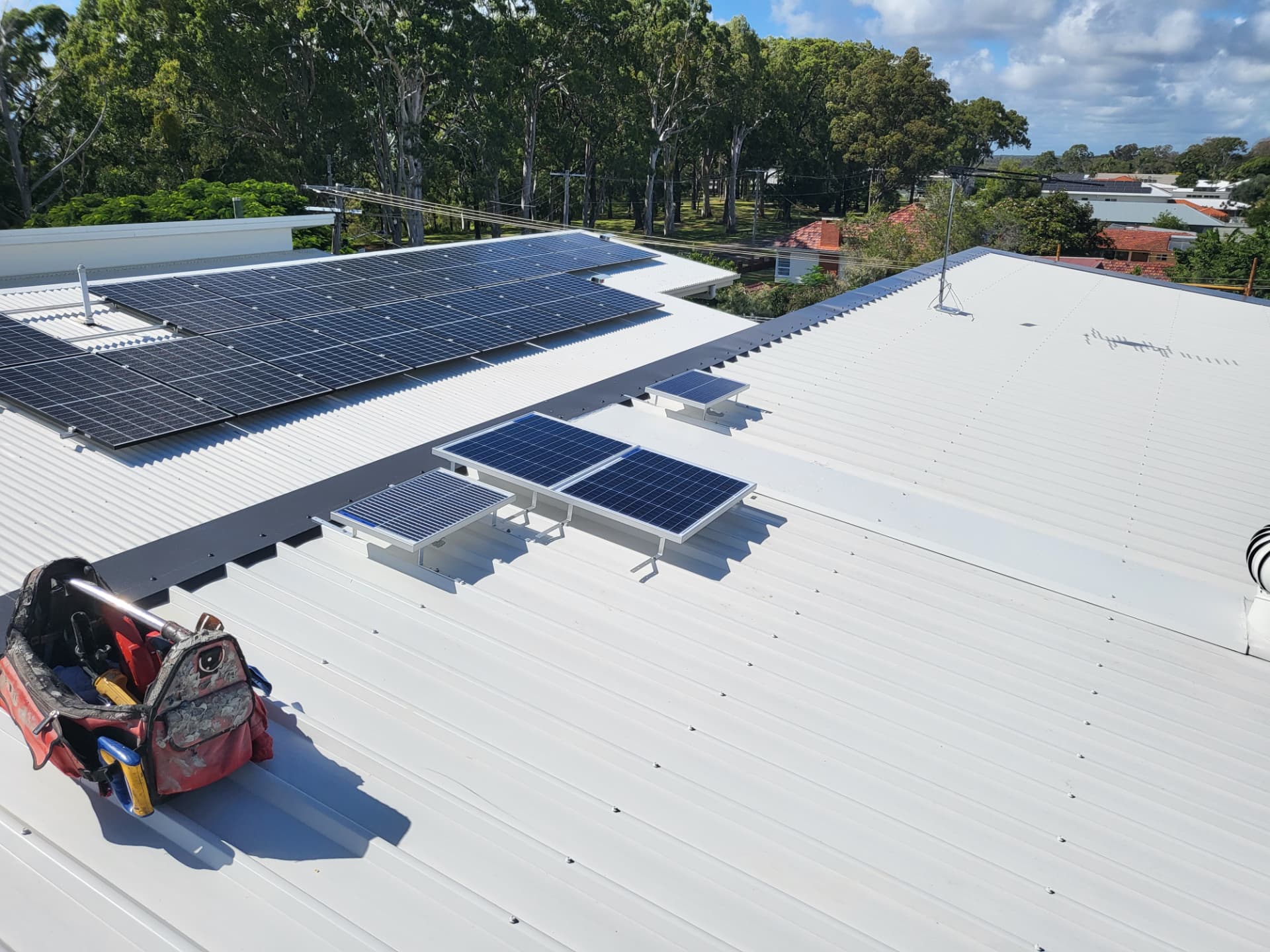 Illume solar collector installed on a corrugated metal roof by Topnotch Skylights